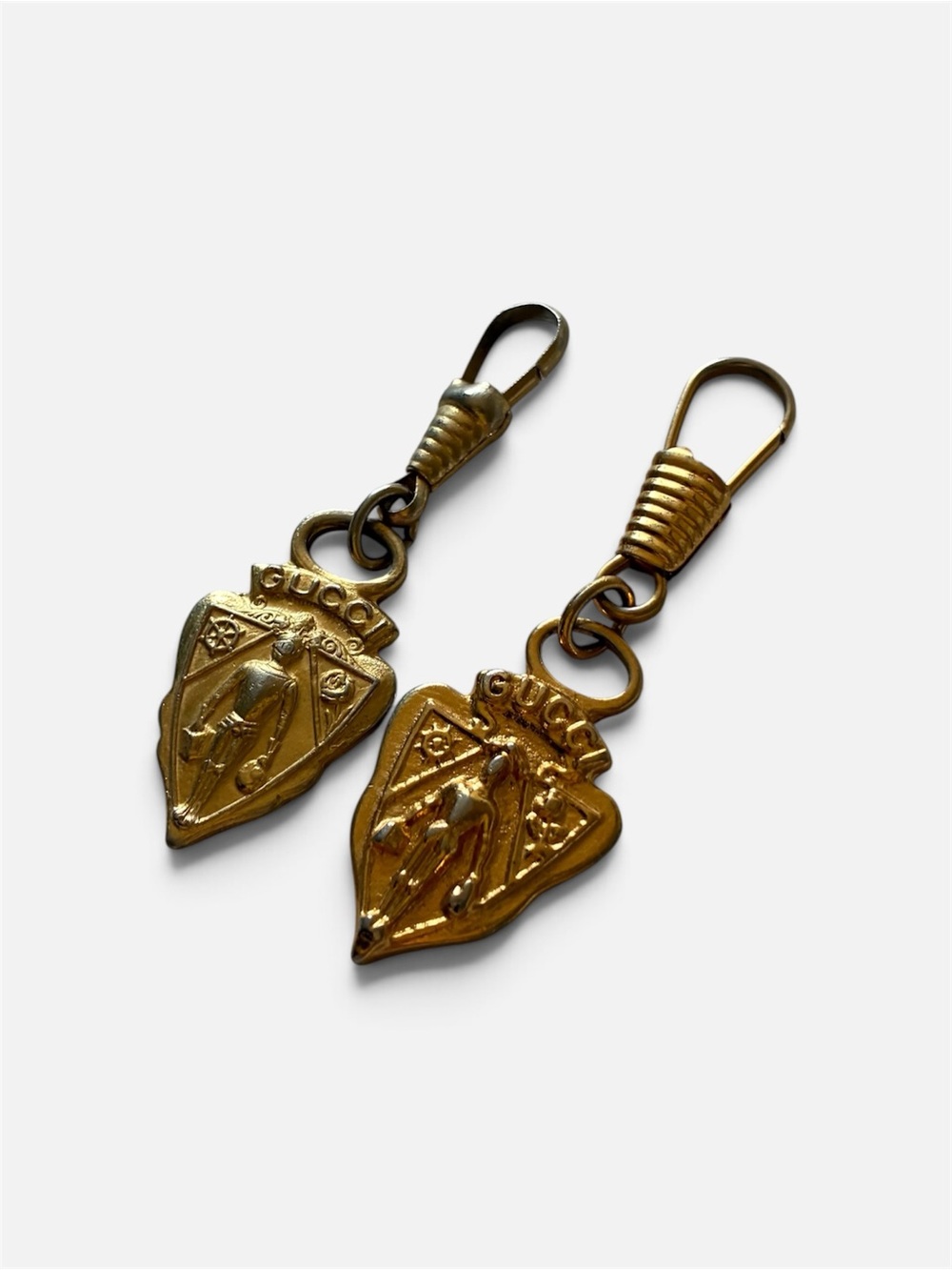 Gucci Gold Shield keychains